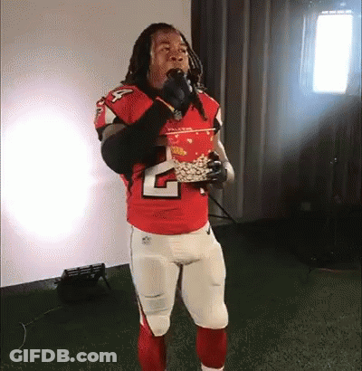 Football Player In Red Jersey Eating Popcorn GIF