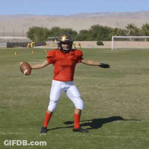 Football Player In Red Jersey Holding Football GIF