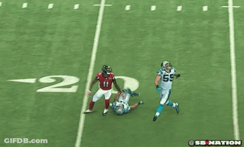 Football Player In Red Jersey Number 11 Runs Past Referee GIF