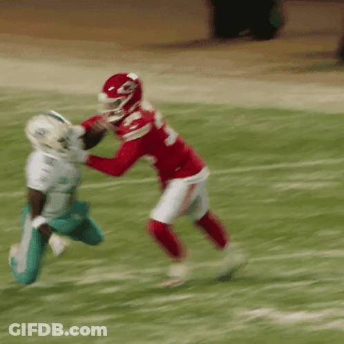 Football Player In Red Jersey Number 23 Tackling GIF