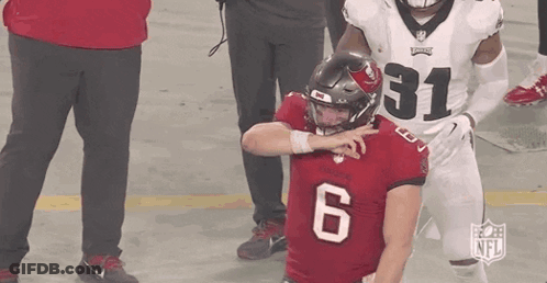 Football Player In Red Jersey Number 6 Being Tackled GIF