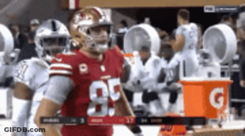 Football Player In Red Jersey Number 85 By Gatorade Bucket GIF