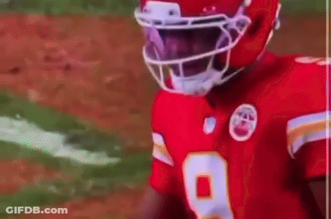 Football Player In Red Jersey Talking To Another Player GIF