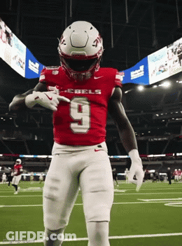 Football Player In Red Rebels Jersey Dancing GIF