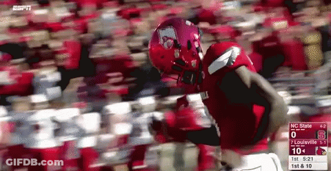 Football Player In Red Uniform Running With Scoreboard GIF