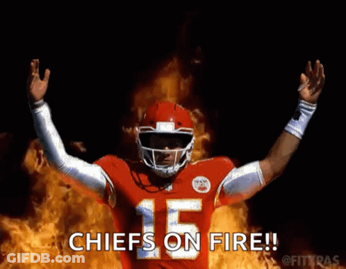 Football Player In Red Uniform Standing In Front Of Fire GIF