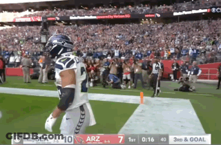 Football Player In Seahawks Uniform Running GIF