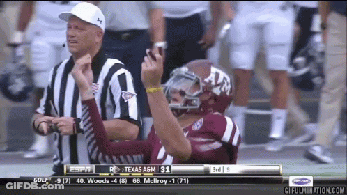 Football Player In Texas A&M Helmet Next To Referee GIF