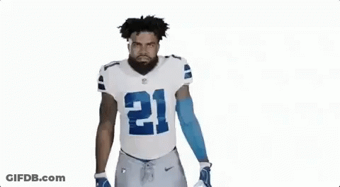 Football Player In White And Blue Uniform Flexing GIF