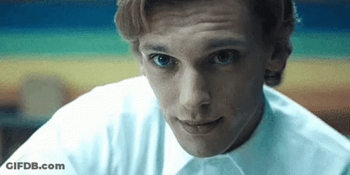 Football Player In White And Blue Uniform Flexing GIF