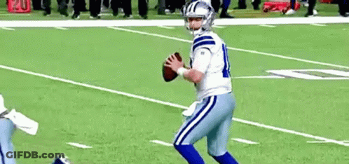 Football Player In White And Blue Uniform Holding Football GIF