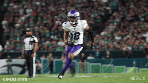 Football Player In White Jersey And Purple Pants Running GIF