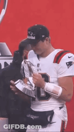 Football Player In White Jersey Holding Trophy GIF