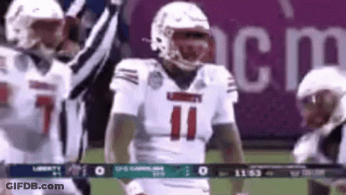 Football Player In White Jersey Number 11 Standing On Field GIF