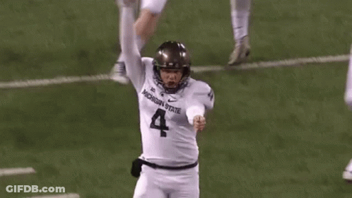 Football Player In White Jersey Number 4 Kicking Ball GIF