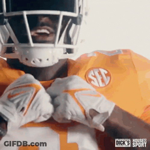 Football Player In Yellow Jersey And Gloves GIF