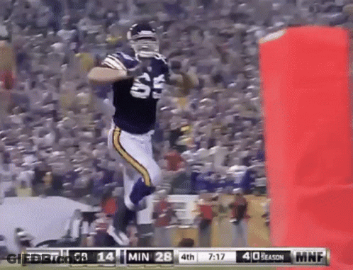 Football Player Jumping During Game Score 28-14 GIF