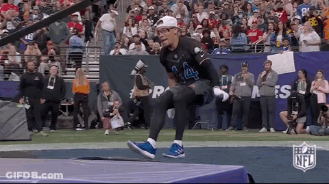 Football Player Jumping Over Hurdle GIF