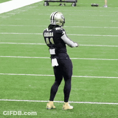 Football Player Kamara Standing On Field GIF