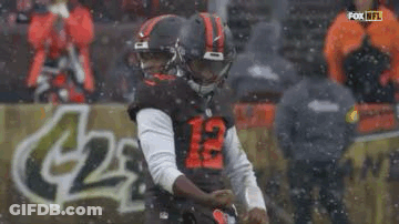 Football Player Kicking Ball In Snow GIF