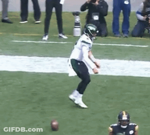 Football Player Kicking Ball While Another Watches GIF