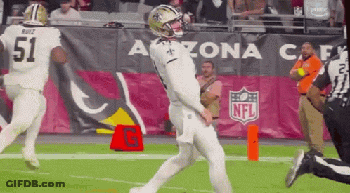 Football Player Kicking Ball With Referee Watching GIF