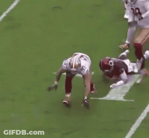 Football Player Kneeling During Tackle GIF