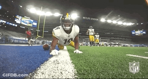Football Player Kneeling Holding Football GIF