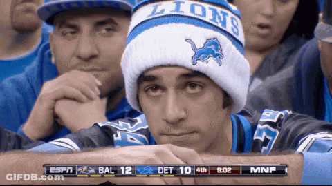 Football Player Kneeling In Crowded Stadium GIF