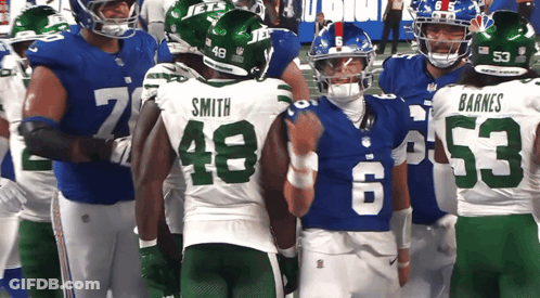 Football Player Kneeling On Field GIF