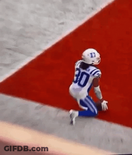Football Player Kneeling On Field GIF