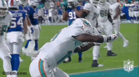 Football Player Kneeling On Field GIF
