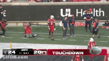 Football Player Kneeling On Field GIF