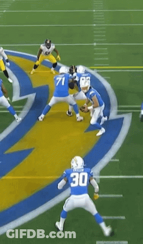 Football Player Kneeling While Referee Watches GIF