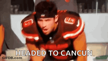 Football Player Kneeling With Headed To Cancun GIF