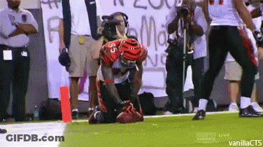 Football Player Kneeling With Number 35 GIF