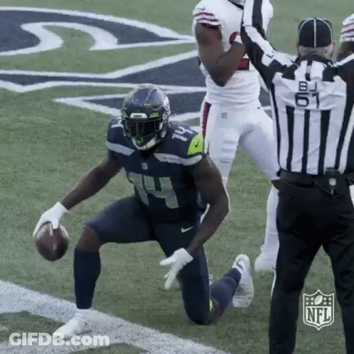Football Player Kneeling With Referee GIF
