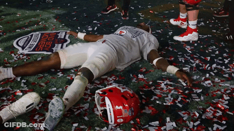 Football Player Laying On Field With Confetti Saying Big Boy Winners GIF