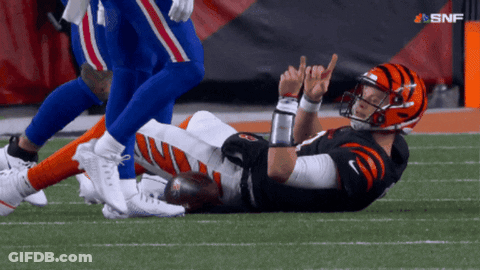 Football Player Laying On Field With SNF Logo GIF