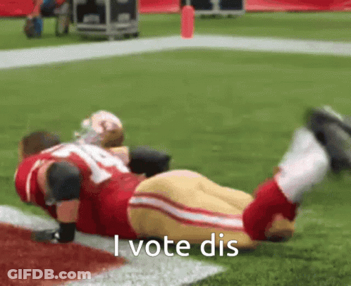 Football Player Laying On Ground Saying I Vote Dis GIF