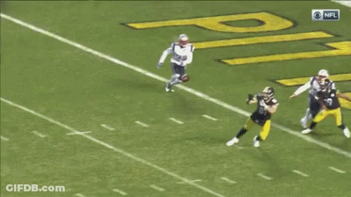 Football Player Lying On Field GIF