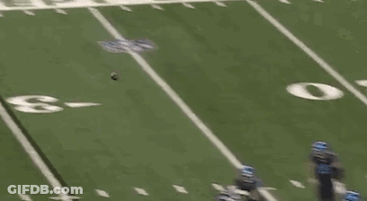 Football Player Lying On Field Referee Watching GIF