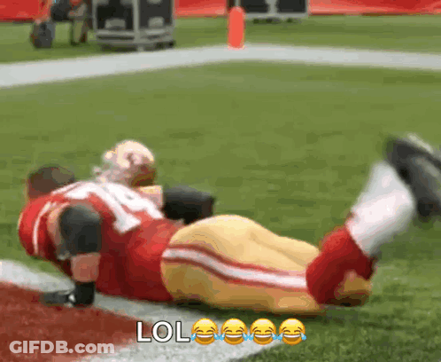 Football Player Lying On Field With LOL Face GIF