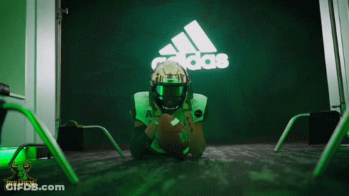 Football Player Lying On Floor In Front Of Adidas Sign GIF
