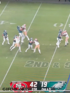 Football Player Number 0 Kneeling On Field GIF