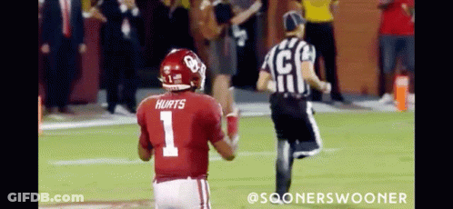 Football Player Number 1 Runs Toward Referee GIF