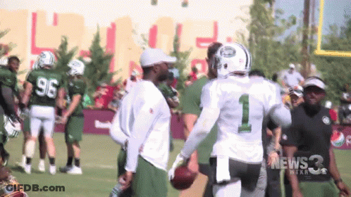 Football Player Number 1 Talking To Another GIF