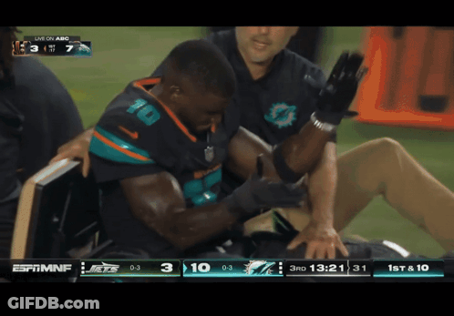 Football Player Number 10 Being Helped GIF
