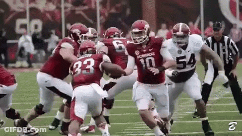 Football Player Number 10 Being Tackled GIF