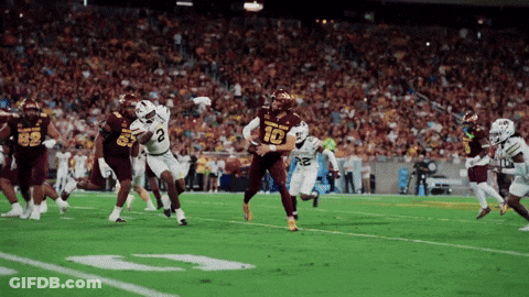 Football Player Number 10 Being Tackled GIF